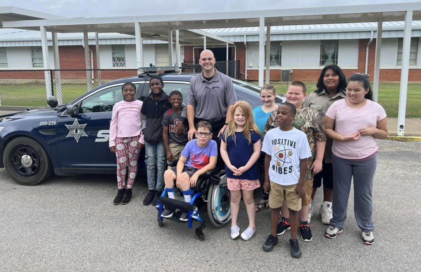 Students in Tanya Mosher’s class stand with Neshoba Central Resource Officer Deputy Dyron Talbert. Pictured, from left: Paris Chamberlin, Stephon Houston, Zy'terrius Ingrum, Deputy Dyron Talbert, Charlee Netherland, Leia McCown, Peyton Prestage, Malik Windham, Jake Butts, Jacob Vaughn, and Kiersten Cotton.