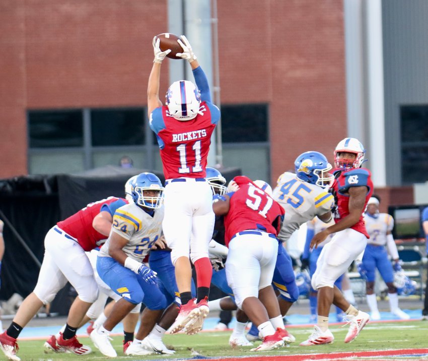 Neshoba Central's Dagan Martin (11) jumps up to receive a pass during the Rockets win over Tupelo.