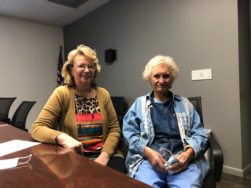 Wanda Lovern, left, a manager at Wells Lamont, sits with Judy Burks, a knitting operator who has worked at the company for 55 years.