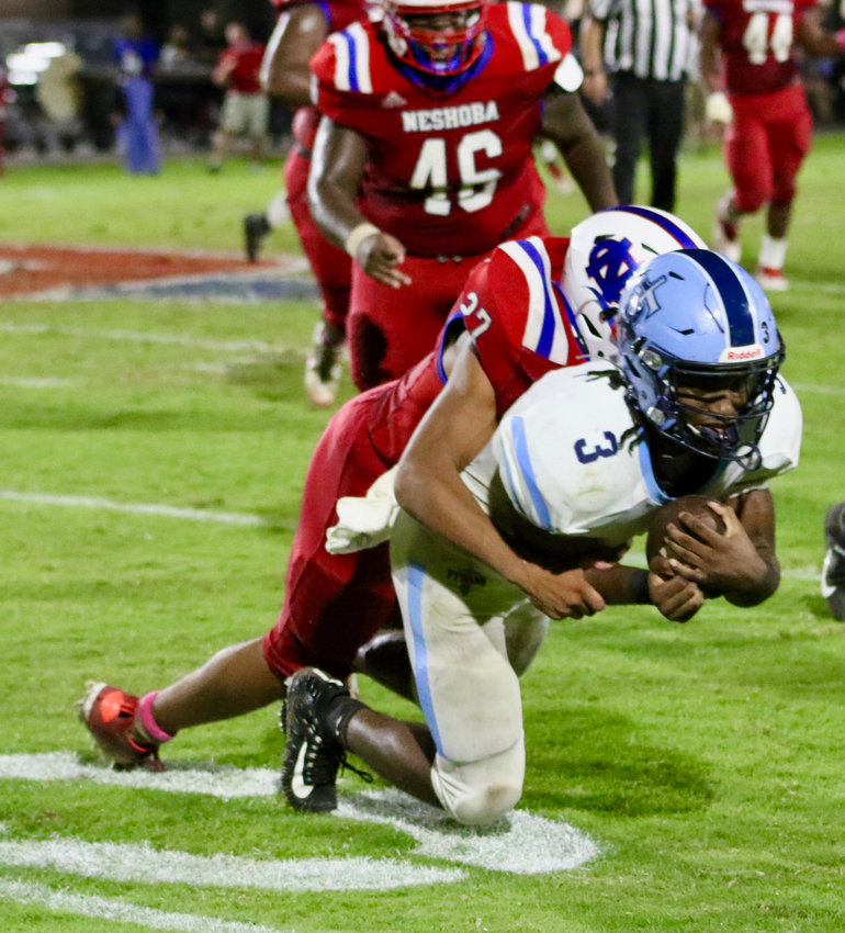 Jarquez Hunter of Neshoba Central (27) has a sack on the Ridgeland quarterback in Friday night's football action.