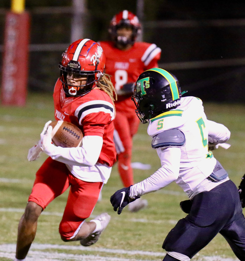 Philadelphia's Dedrick McWilliams (5) finds a hole to pick up some yards in the Tornadoes loss to Taylorsville Friday night.