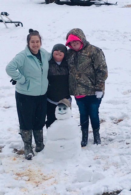 In the Bloomo community, Nikki, Bentley, Desiree, and Kylie Ann Leach enjoy the snow.