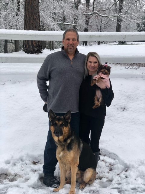 John and Melinda Breazeale along with Diesel and Piper in the snow.