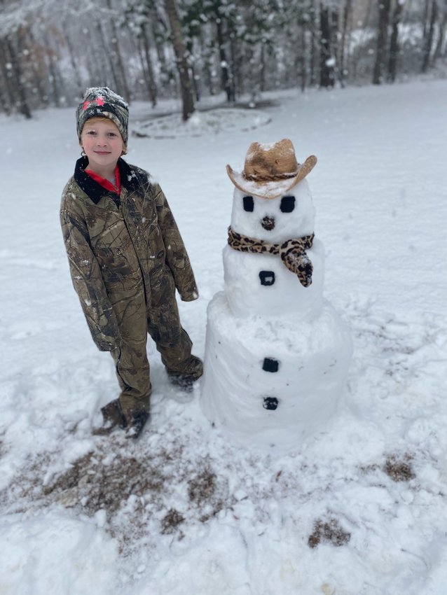 Zander Abel, 6, enjoying his snow day building his snow cowboy!