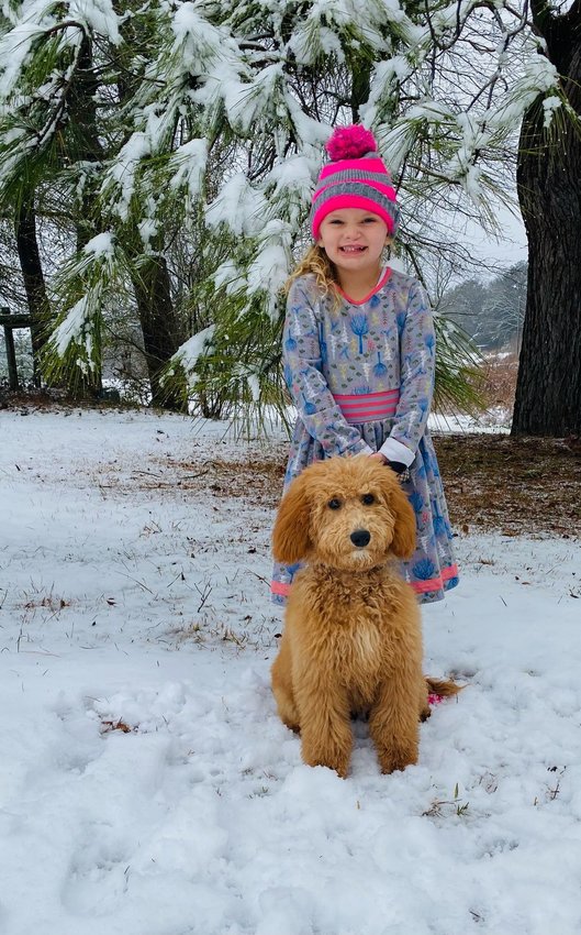 Alivia Rayne Vowell and Gypsy Rose in the snow.