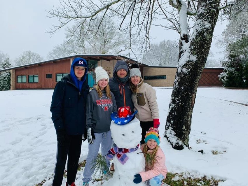 The Griffis family poses with “Dwight” the snowman, Pictured, left to right, are: Sanders, Maggie Lee, Wright, Leslie, and Laney.
