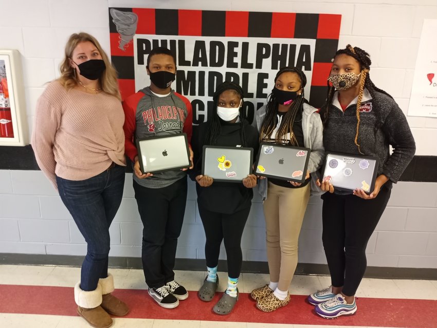 Philadelphia students in grades 7-12 were recently issued new MacBook Air computers to use throughout the school year. These eighth grade students are proudly showing their MacBook Airs. From left, teacher Sarah Alexander, Bre-lon Tanksley, Abby Peebles, Kensleigh Shields and J’Niya Gray.