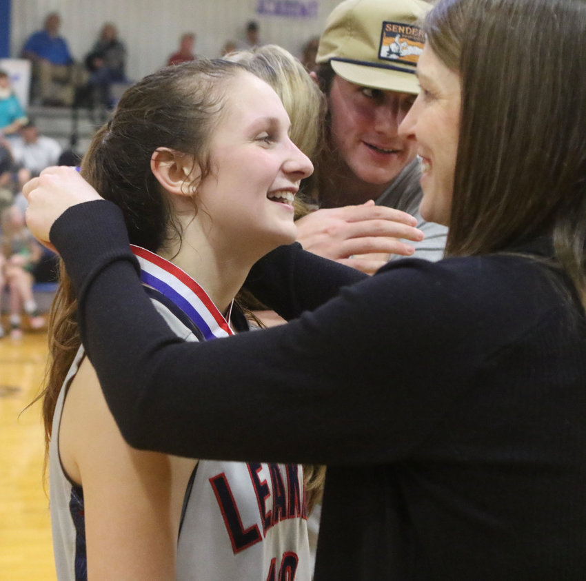 Leake Academy’s Miriam Prince gets her championship medal after helping the Rebelettes win the Class AAAA state championship on Saturday at Hillcrest Christian.