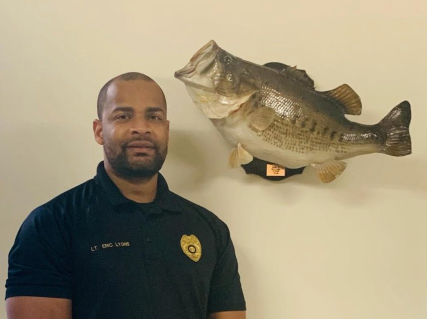 Police Chief Eric Lyons shown with the 12-pound bass he caught at Neshoba Lake that was a record.