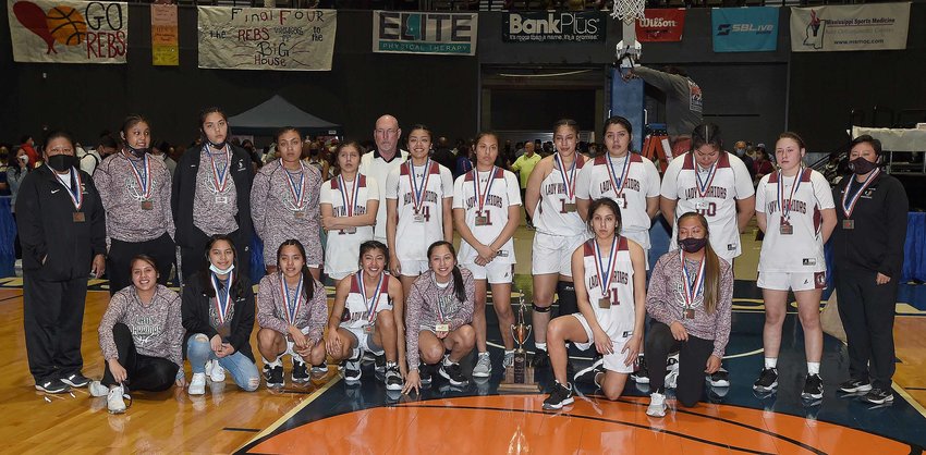 The Choctaw Central Lady Warriors pose for pictures after the MHSAA Class 4A State Basketball Championship on Thursday, March 4, 2021, at the Mississippi Coliseum in Jackson, Miss.