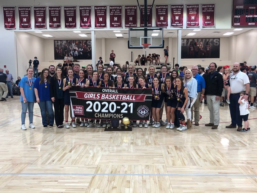 The Leake Academy Rebelettes celebrate winning the 2020-2021 Overall Girls Basketball Tournament.
