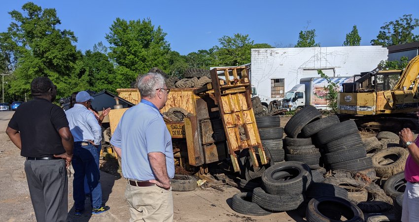 City officials are continuing to fine the owner of Hardy Tire after they visited the property last week and determined more work needs to be done. At left is Mayor James A. Young. Ward 2 Alderman Jim Fulton is at right.