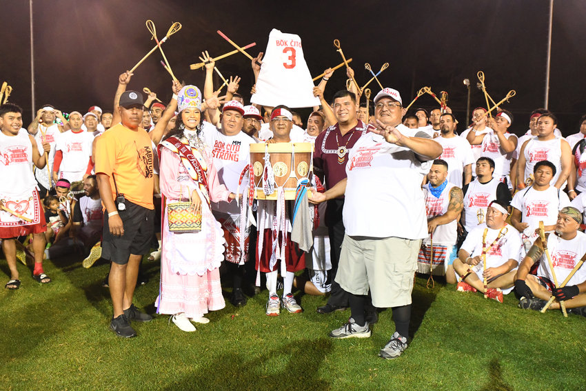 Bok Cito celebrates after winning the World Series of Stickball. Newly-crowned Choctaw Princess Shemah Crosby and Tribal Chief Cyrus Ben presented the trophy.
