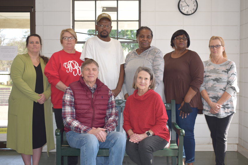 With Danny and Regina Hicks are Gipson Cleaners employees Candala Ainsworth, Barbara Bates, Curtis McDonald, Martha Young, Penny Stewart and Deborah Cumberland.