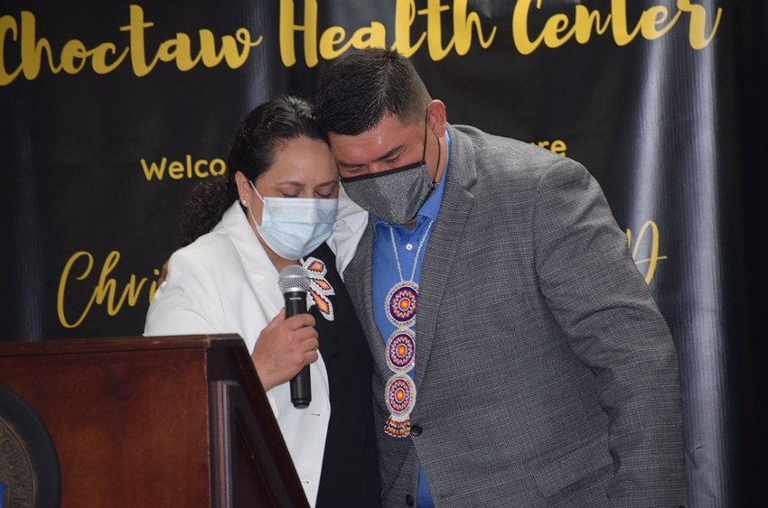 Tribal Chief Cyrus Ben, right, hugs Dr. Christina Wallace.