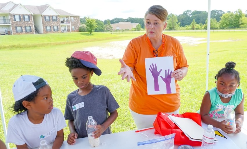 Jackie Cheatham teaches children during Vacation Bible School during last year’s Love Out Loud event. Vacation Bible School is one of a number of ways community members gather to serve during the annual outreach program.