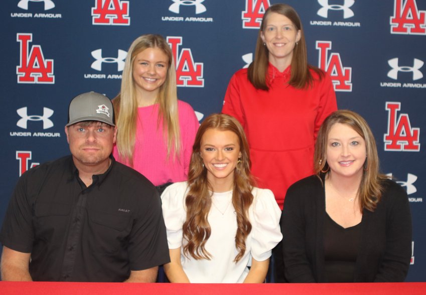 Freeny is shown with her parents, Derek and Marissa Freeny. On the back row is sister, Gabby Freeny and Leake Academy coach Amanda Hatch.