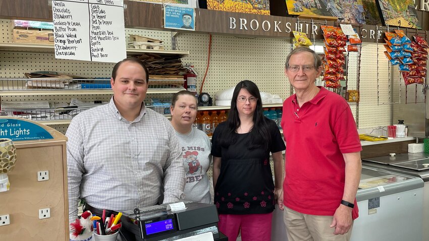 Stribling Drugs employees stand at the front counter. Pictured, from left: Jacob Buntyn, pharmacist, Candace Barlow, pharmacy tech, Stacie Jones, pharmacy tech, and owner Larry Stribling. Stribling’s just celebrated 75 years.