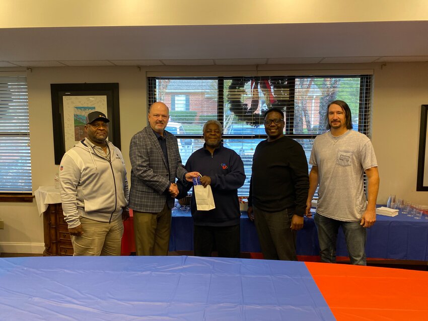 Pictured are, from left, PU board member Anthony Cunningham, PU General Manager Kirk Morgan, James Harris, PU Board Chairman Darryl Young and board member Philip Prince.