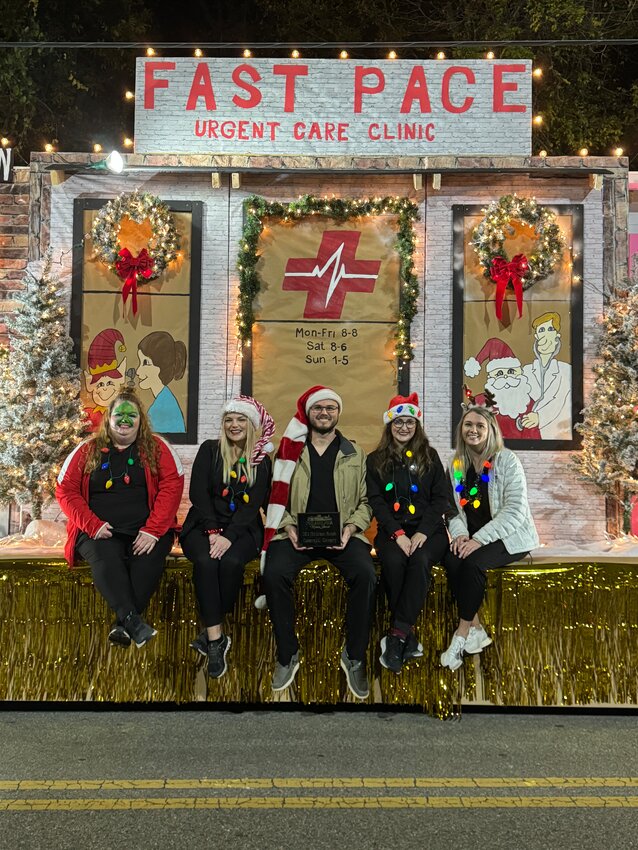 Fast Pace employees took home 1st place in the Philadelphia Christmas Parade Commercial Division. Pictured from left are nurse Sam Dearing, receptionist Ashley Smith, nurse practitioners Jason Copeland and Anna Lewis, and nurse Ashley Crapps. Not Pictured is receptionist Peyton Floyd.