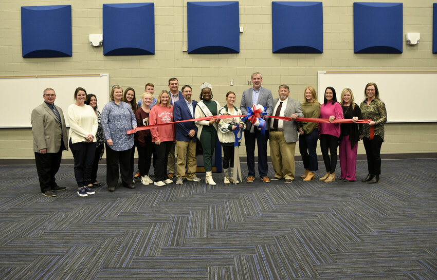 Pictured from left are Richard Boykin, Middle School Choral Director; Ashley Wade, Assistant Band Director; Dr. Angela Boatner, High School Choral Director and Theater Instructor;  Amanda May, Assistant Band Director; Avery Kate Holland, Member of the Big Blue Band; Leigh Allyn Stroud, Member of the Big Blue Band; Ryan Bays, Assistant Band Director; Nacole Brantley, Member of the Big Blue Band;  Tommy Holland, Assistant Superintendent of Education; Daniel Wade, HS Band Director;  Marlee Washington, Miss Black Neshoba County; Gracie Dertinger, Member of the Big Blue Band; Josh Perkins, Superintendent of Education; Wyatt Waddell, School Board Member; Rhonda Holley, School Board Member; Mary Ann Nicholson, School Board Member; Jill Byars, School Board Member and Dr. Penny Sistrunk, Assistant Superintendent of Education.
