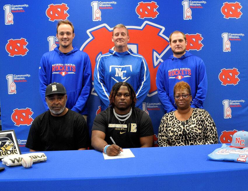 Pictured seated, from left, are his dad, Mark West, Demarkez West, and his mom, Felicia West. (Back) Assistant Coach Tanner Jones, Head Coach Jonathan Jones, and Assistant Coach Kip Fulton.