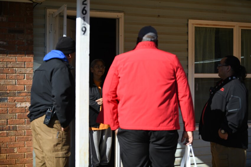 Members of the Choctaw Fire Department and American Red Cross visit a home in the Pearl River community to install free smoke alarms.