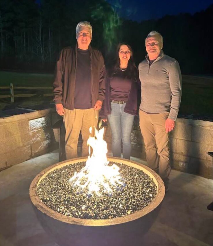 The Philadelphia Country Club recently dedicated two beautiful fire pits in loving memory of Billy Gene and Helen Tolbert, who loved the game of golf, especially at PCC. From left, Robert Tolbert, Tammy Tolbert Tawater and George Tawater were present. Thanks to George for the design, construction, and installation.
