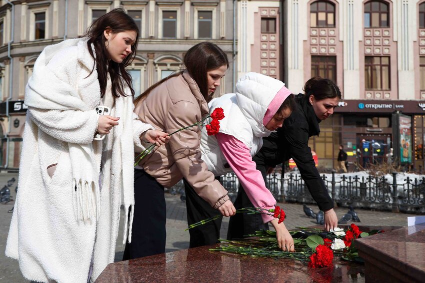 Russia, Kazan - March 23, 2024: People lay flowers at a makeshift memorial for the victims of the Crocus City Hall terrorist attack. On March 22, 2024, unidentified gunmen opened fire before the start of a concert at the Crocus City Hall in the town of Krasnogorsk near Moscow, and set off explosives that started a massive fire in the building. The Russian Investigative Committee reports over 60 people dead, more than 100 wounded. The Islamic State (banned in Russia) claimed responsibility for the attack. Photo by Yegor Aleyev/TASS/ABACAPRESS.COM
